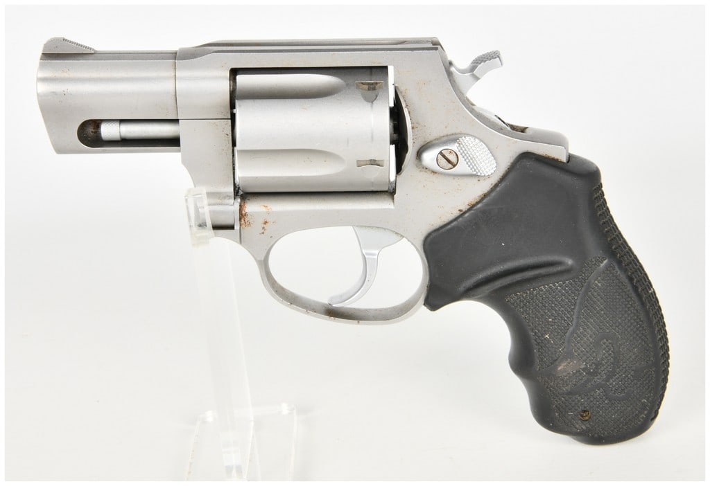 Taurus Model 605 Double-Action/Single-Action Revolver .357 Magnum with 2 Inch Barrel: This Taurus Model 605 is a compact five-shot double-action/single-action revolver chambered in .357 Magnum. The firearm is equipped with a 2-inch barrel featuring a fixed front ramp sight and an integ
