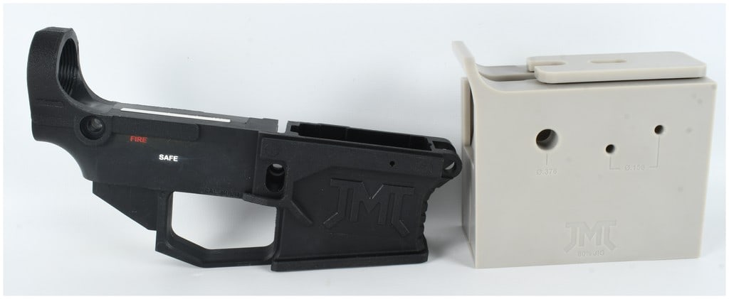 A JMT Polymer Lower Receiver and Machining Jig Set: This lot features a James Madison Tactical (JMT) 80% AR-style lower receiver accompanied by a corresponding two-piece machining jig. The lower receiver is manufactured from black polymer and includes 