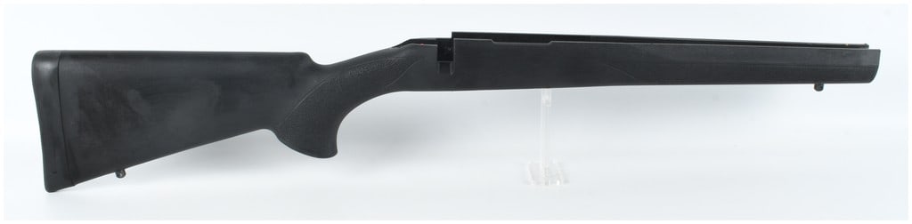 New Synthetic Stock for a Howa Mini-Action Rifle: A new synthetic bolt-action rifle stock constructed from black textured polymer, designed for a Howa Mini-Action. The stock features an integrated black rubber recoil pad at the butt and two metal sli