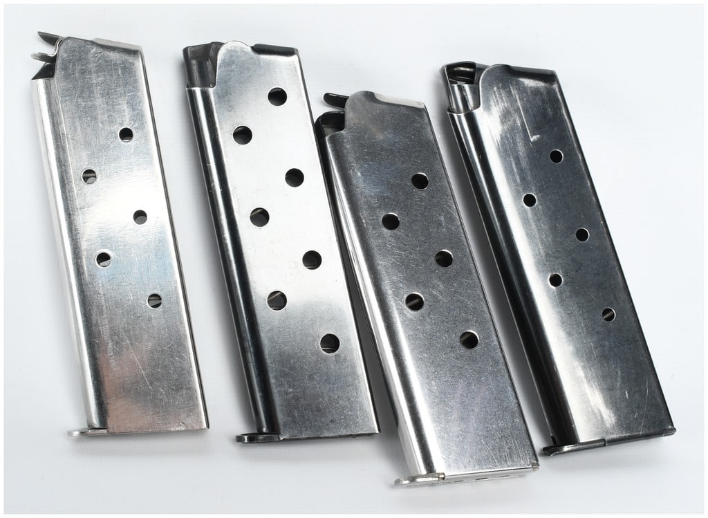 A Group of Four Randall and Kimber 1911 Single-Stack Magazines .45 ACP: This lot consists of a group of four single-stack magazines designed for 1911-style semi-automatic pistols chambered in .45 ACP. The collection includes two stainless steel and two blued steel magazin