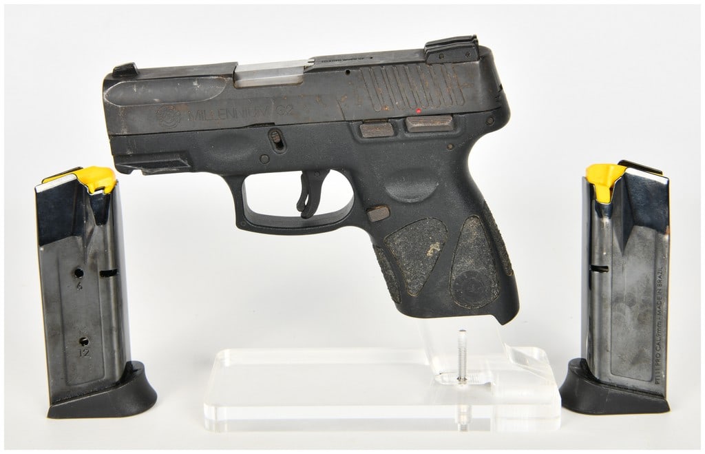 Taurus Millennium G2 PT111 Semi-Automatic Pistol 9mm with 3.2 Inch Barrel: This Taurus Millennium G2 model PT111 semi-automatic pistol is chambered in 9mm and features a 3.2 inch barrel. The firearm is constructed with a black polymer frame and a steel slide with a blued fin