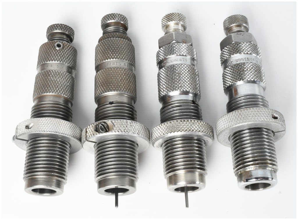 A Group of Four .257 Roberts Reloading Dies: This lot consists of a group of four reloading dies chambered for .257 Roberts, designed for ammunition handloading. The grouping comprises two distinct pairs based on finish and configuration. The