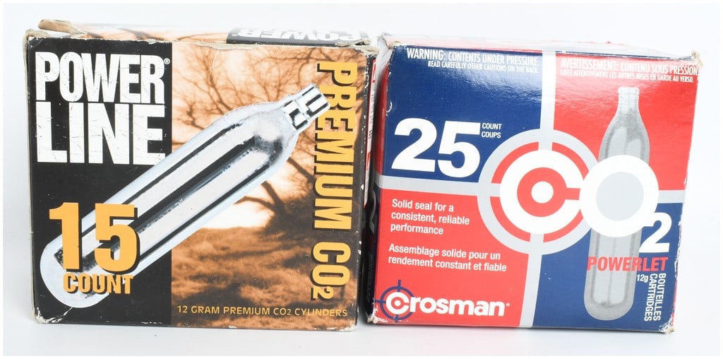 A Lot of 40 Crosman and Powerline 12 Gram CO2 Cartridges: This lot features a total of 40 individual 12-gram CO2 cartridges, consisting of one 25-count box of Crosman CO2 Powerlets and one 15-count box of Powerline Premium CO2 cylinders. These standard-sized
