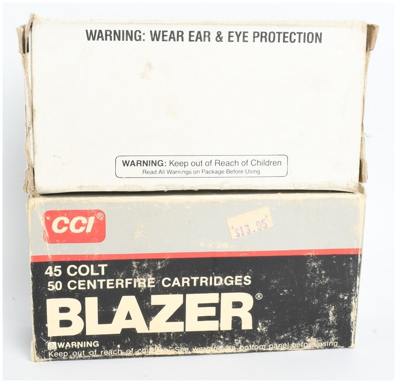 Remington-Peters .45 Colt Ammunition 100 Rounds: This lot consists of 100 rounds of .45 Colt centerfire ammunition loaded with 255-grain lead semi-wadcutter projectiles. The cartridges feature brass casings and silver-colored primers. The ammunition