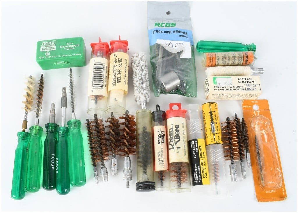 A Collection of 27 RCBS, Lyman, and Kleen-Bore Gun Cleaning and Reloading Accessories: This comprehensive collection features 27 assorted tools and accessories designed for firearm maintenance and reloading, with a focus on prominent manufacturers. The reloading equipment includes an RC