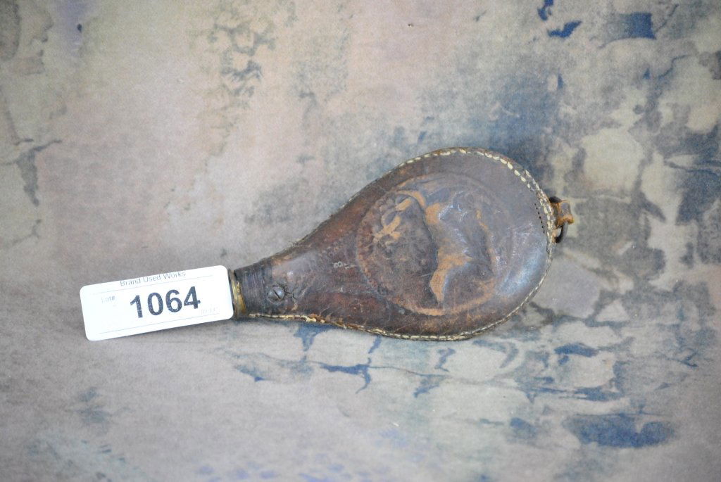 Antique hand tooled leather powderhorn: artwork is a hunting dog and there is a number 3 stamped on the back.