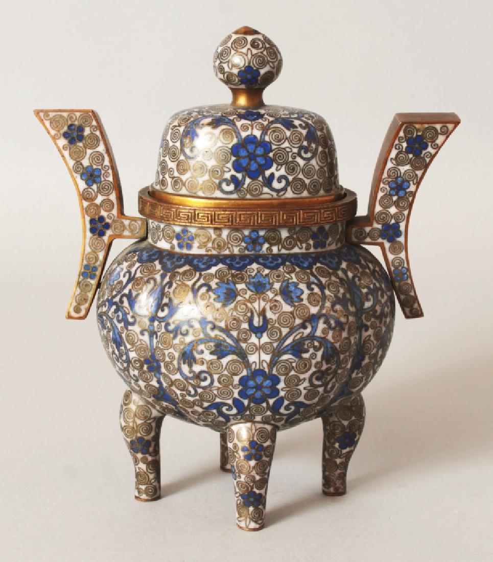 A 19TH CENTURY CHINESE WHITE GROUND CLOISONNE CENSER &: A 19TH CENTURY CHINESE WHITE GROUND CLOISONNE CENSER & COVER, decorated with formal foliage and scroll-form cloisons, 5.1in diameter including handles & 6.1in high overall.