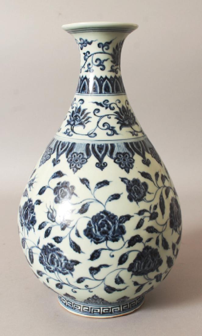 A CHINESE MING STYLE BLUE & WHITE PORCELAIN: A CHINESE MING STYLE BLUE & WHITE PORCELAIN YUHUCHUNPING VASE, the sides decorated with formal scrolling flowerheads, the base with a six-character Xuande mark, 12.5in high.