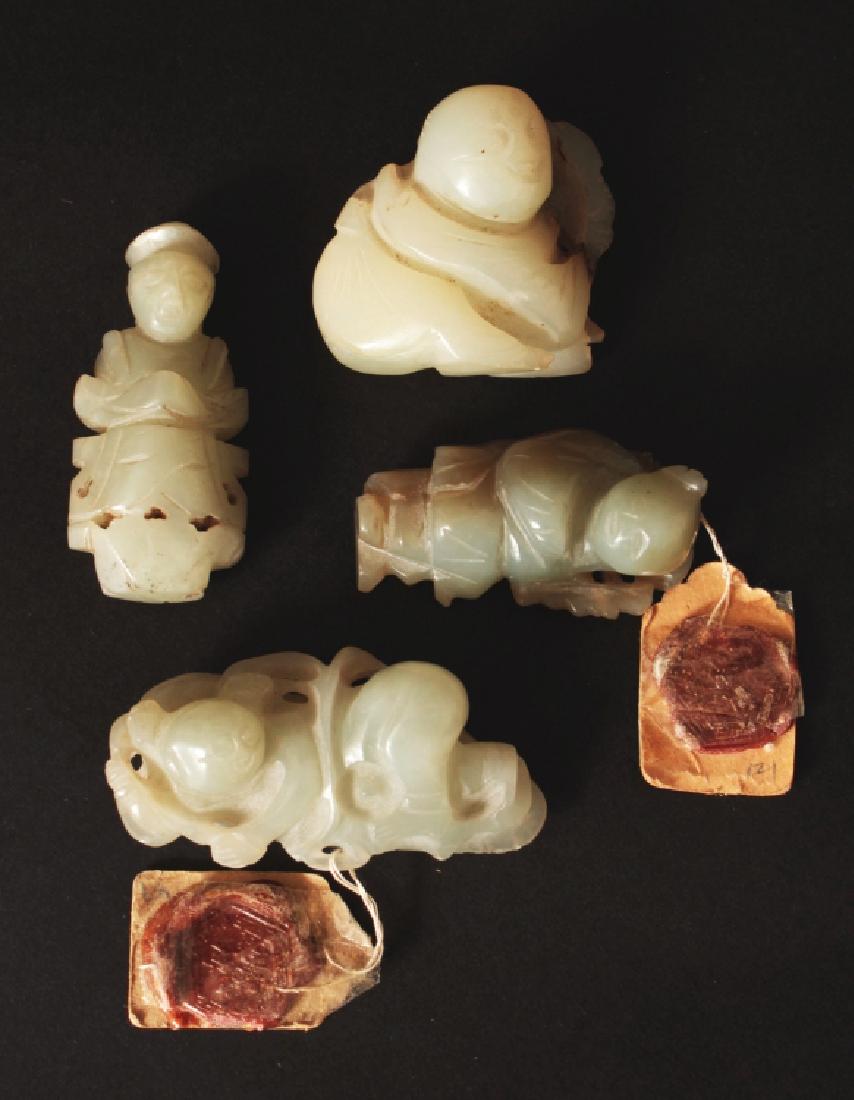 A GROUP OF FOUR CELADON JADE FIGURAL CARVINGS, mainly (1 of 2)