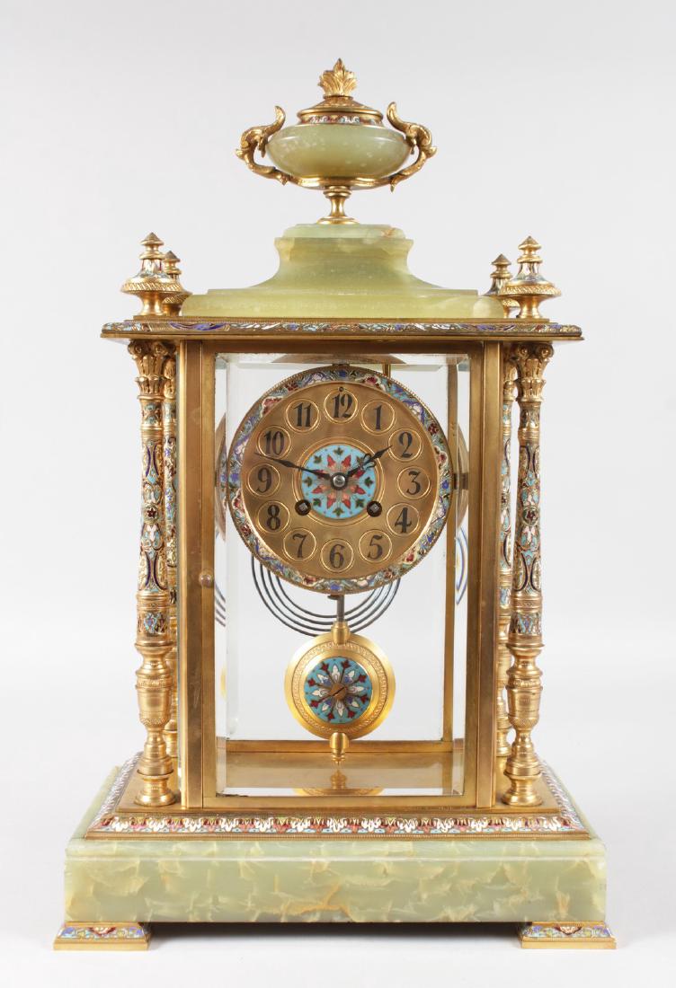 A GOOD LARGE 19TH CENTURY FRENCH ONYX AND CHAMPLEVE: A GOOD LARGE 19TH CENTURY FRENCH ONYX AND CHAMPLEVE ENAMEL CLOCK with eight-day movement, urn finial and column sides and bevelled glass, supported on champleve enamel bracket feet. 19ins high.