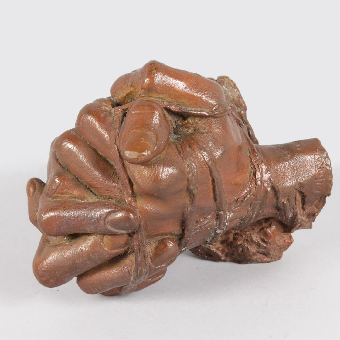 IGOR MITORAJ (1944-2014) POLISH (born in GERMANY) A: IGOR MITORAJ (1944-2014) POLISH (born in GERMANY) A STRIKING BRONZE OF BOUND CLASPED HANDS. Signed Igor Mitoraj, No. 215/250. 7ins high, 5.5ins wide.