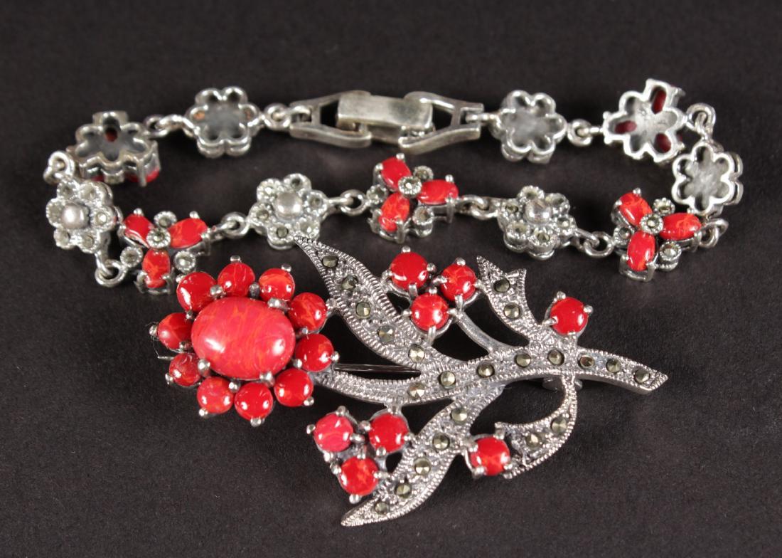 A SILVER MARCASITE CORAL BRACELET AND BROOCH.: A SILVER MARCASITE CORAL BRACELET AND BROOCH.
