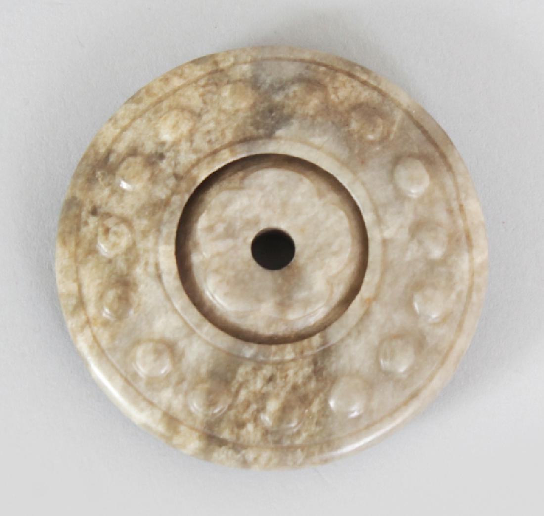 A CHINESE JADE BI DISC, together with a silk covered (1 of 6)