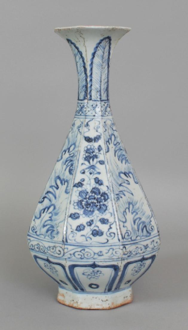 A CHINESE YUAN STYLE BLUE & WHITE PORCELAIN VASE, of: A CHINESE YUAN STYLE BLUE & WHITE PORCELAIN VASE, of octagonal section and yuhuchunping form, decorated with alternating wave and peony panels, 11.8in high.