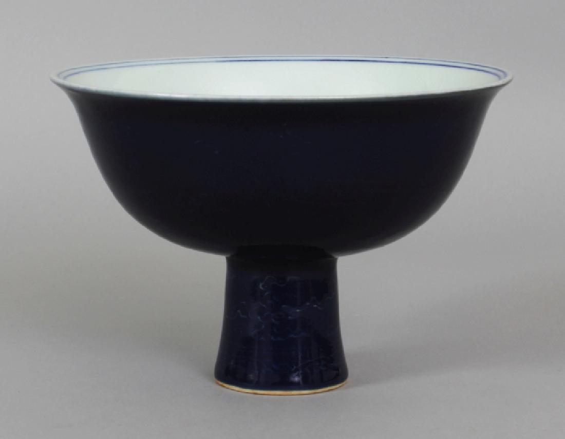 A CHINESE BLUE GLAZED PORCELAIN STEM BOWL, the sides (1 of 5)