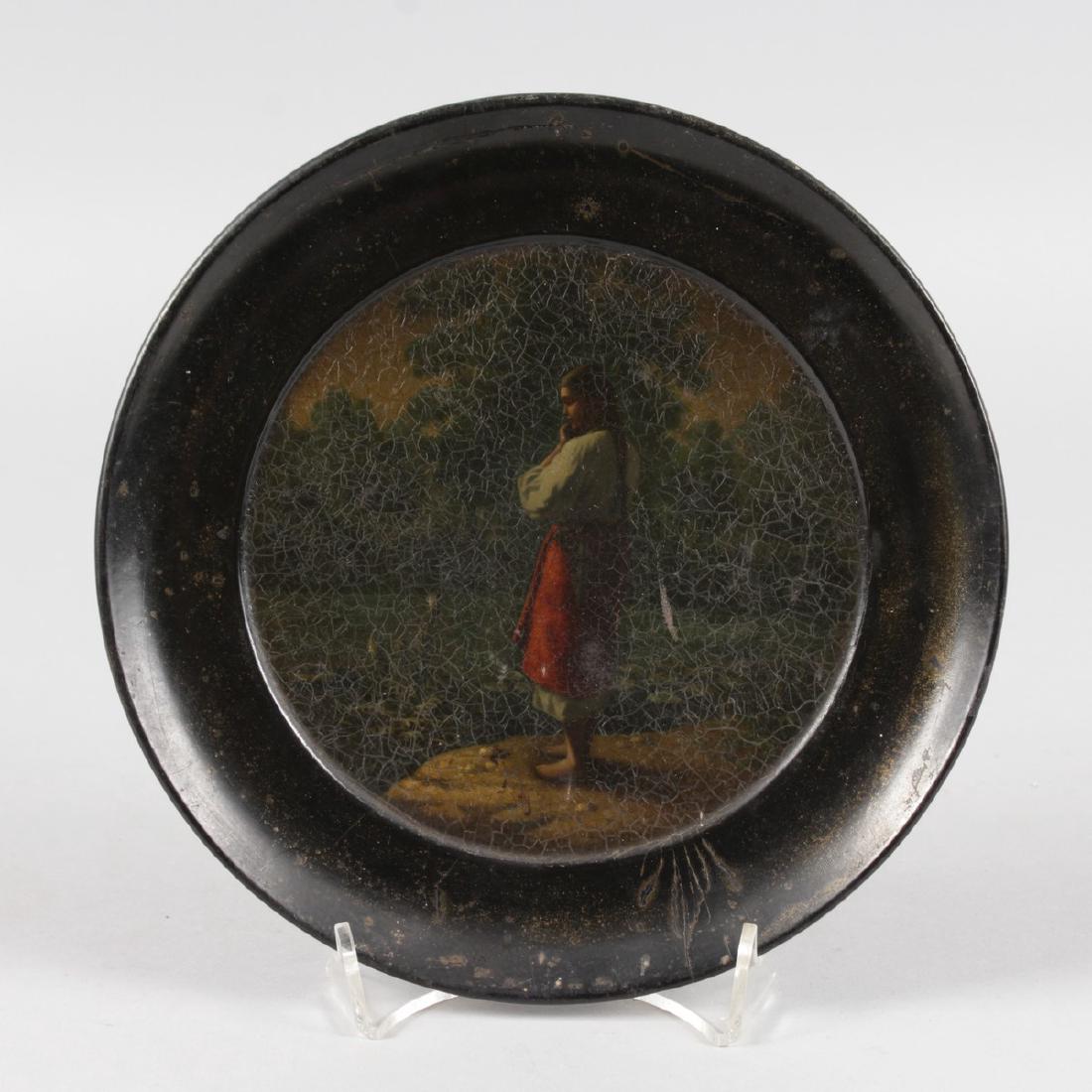 A RUSSIAN CIRCULAR PAPIER MACHE PLATE painted with a (1 of 4)