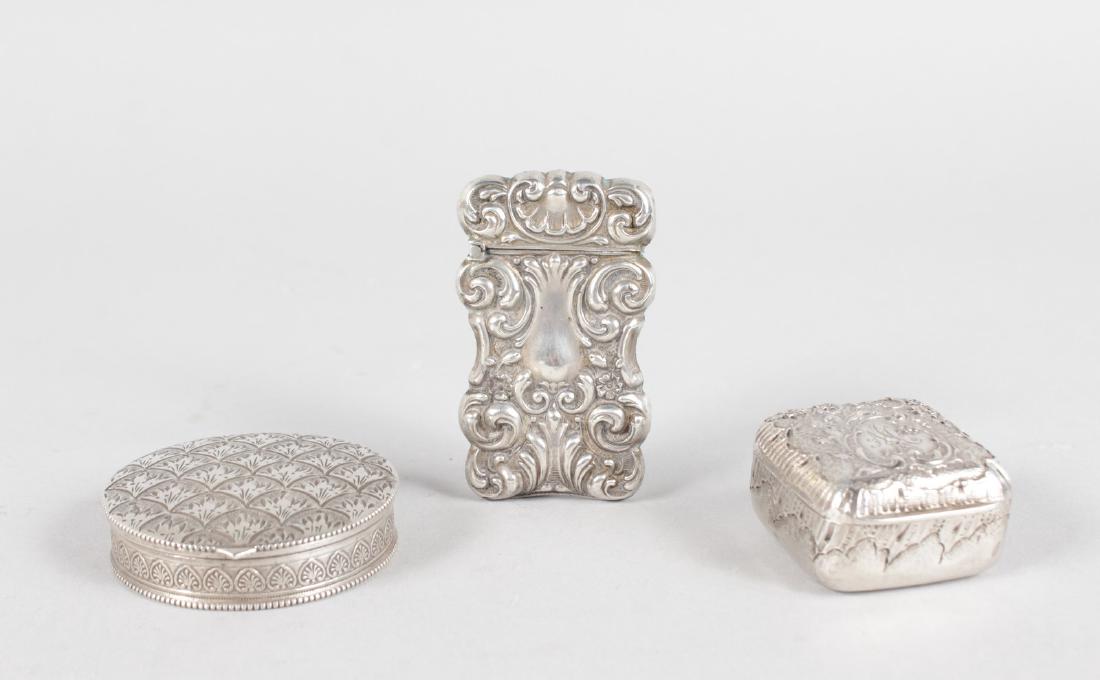 A SILVER VESTA and TWO BANGLES. (1 of 5)