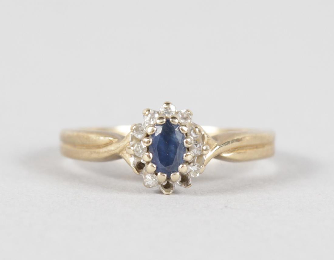 A BRILLIANT AND BLUE STONE OVAL 9CT YELLOW GOLD RING. (1 of 4)