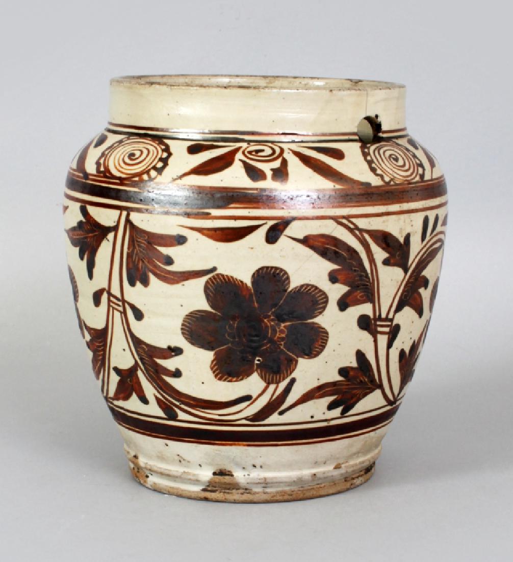 A CHINESE YUAN/MING DYNASTY CIZHOU CERAMIC JAR, the (1 of 10)
