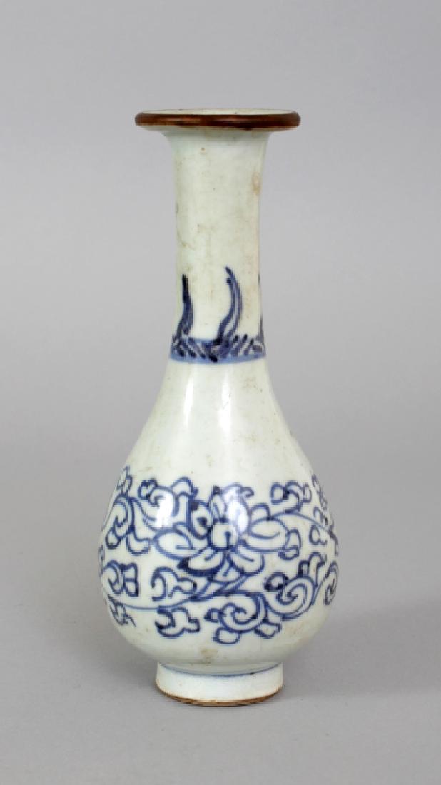 AN EARLY 18TH CENTURY CHINESE BLUE & WHITE PORCELAIN: AN EARLY 18TH CENTURY CHINESE BLUE & WHITE PORCELAIN VASE, the sides of the pear-form body painted with scrolling lotus, 5.5in(14cm) high. Excavated in the Tenasserim Valley near Mergui 1933/34.