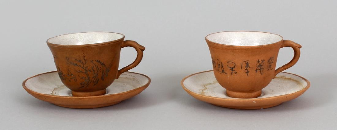 A NEAR PAIR OF 19TH/20TH CENTURY PARTIALLY GLAZED: A NEAR PAIR OF 19TH/20TH CENTURY PARTIALLY GLAZED YIXING POTTERY TEA CUPS & SAUCERS, each piece applied to its interior with a white crackled glaze, the base of each saucer with a seal mark, the cups 