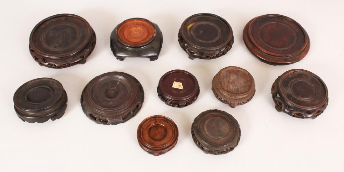 A GROUP OF ELEVEN CHINESE CARVED HARDWOOD VASE STANDS, (1 of 6)