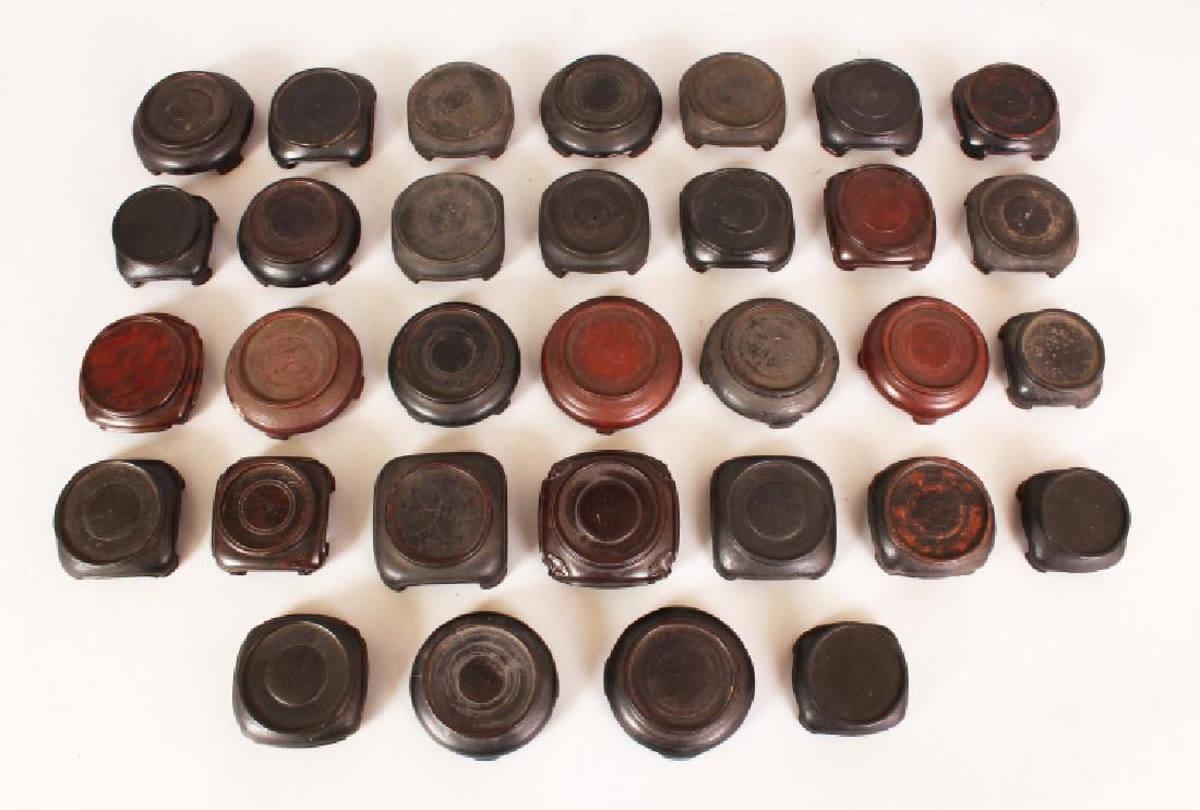 A GROUP OF THIRTY TWO SMALL CHINESE HARDWOOD VASE (1 of 5)