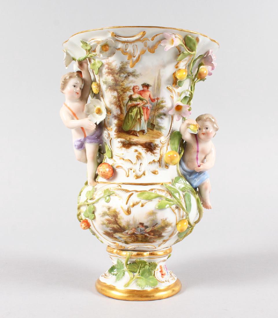 A GOOD MEISSEN TRUMPET SHAPED VASE, encrusted with: A GOOD MEISSEN TRUMPET SHAPED VASE, encrusted with fruit, flowers and two cupids. Cross swords mark in blue. 19.5cms high.