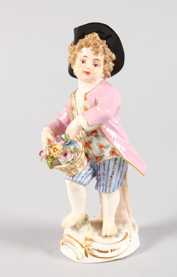 A SMALL MEISSEN FIGURE OF A YOUNG BOY holding a basket: A SMALL MEISSEN FIGURE OF A YOUNG BOY holding a basket of flowers. Cross swords mark in blue. 13cms high.