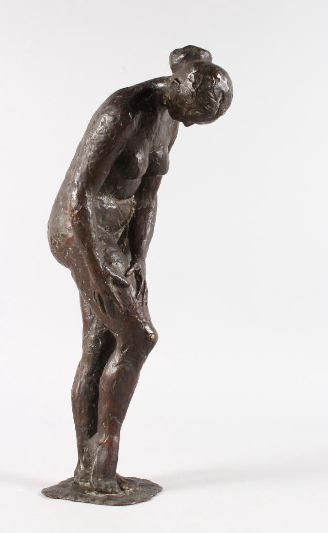 ATTRIBUTED ANDERS ZORN (1860-1920) SWEDISH A bronze: ATTRIBUTED ANDERS ZORN (1860-1920) SWEDISH A bronze standing nude, both hands on her leg. Monogrammed. 15ins high, 38cms high.