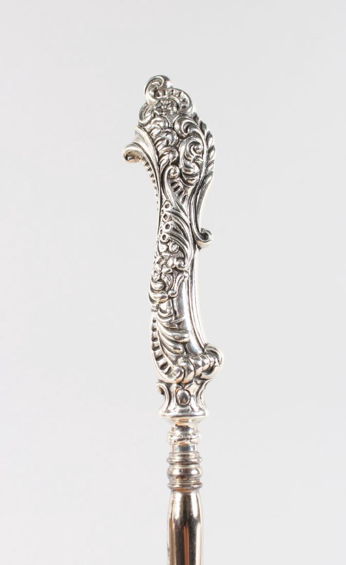 A VICTORIAN SILVER HANDLED BUTTON HOOK, 7ins long.: A VICTORIAN SILVER HANDLED BUTTON HOOK, 7ins long. Birmingham 1896. Adie & Lovekin Ltd.