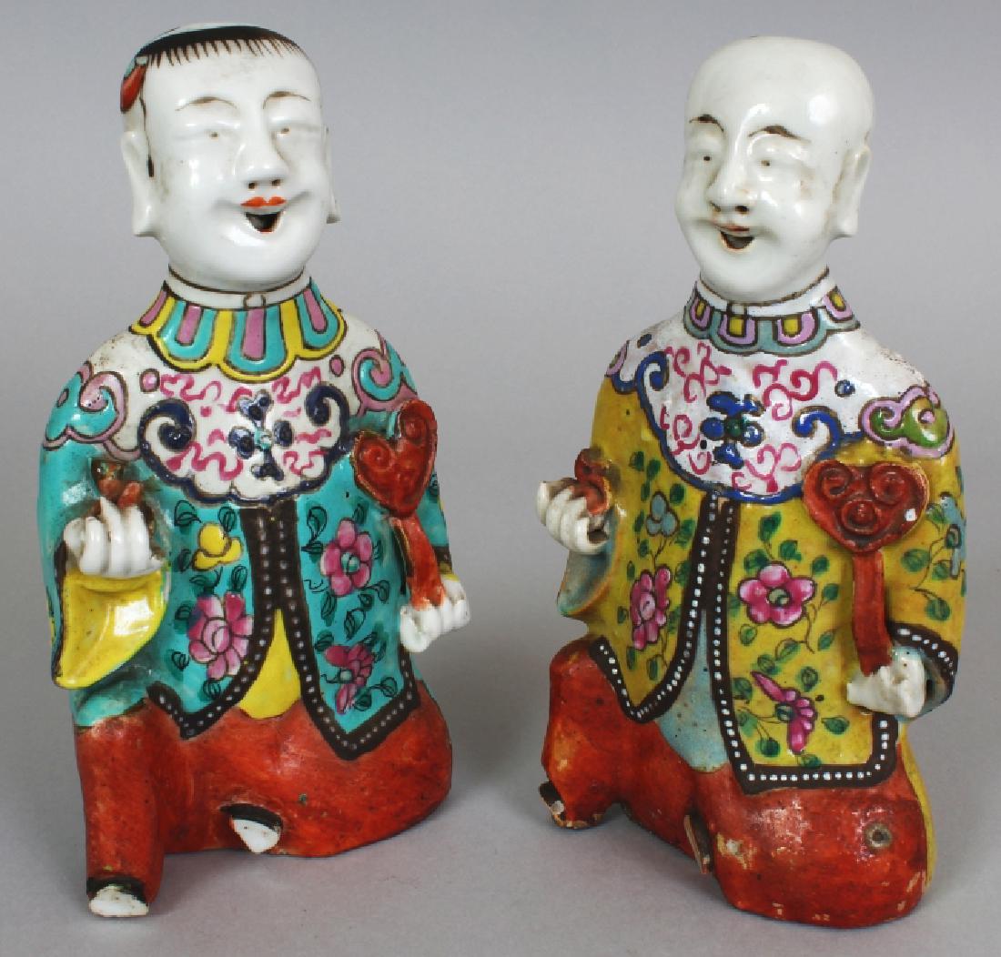 A PAIR OF CHINESE FAMILLE ROSE FIGURES OF KNEELING (1 of 8)