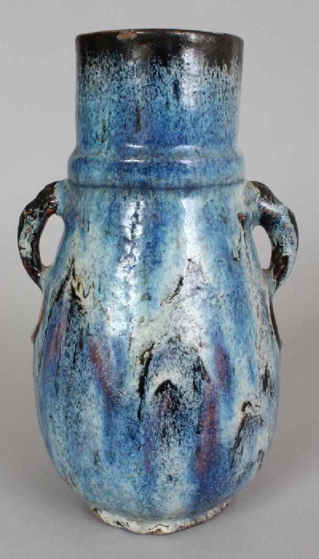 A CHINESE FLAMBE GLAZED PORCELAIN VASE, applied with (1 of 7)