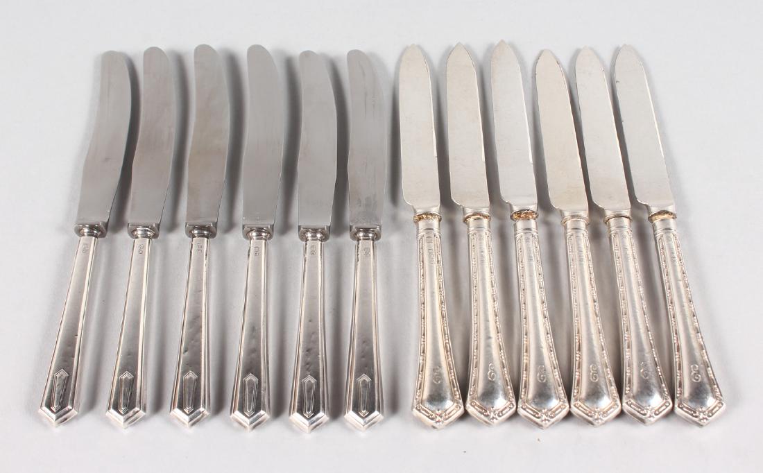 TWO SETS OF SIX SILVER HANDLED TEA KNIVES (12).: TWO SETS OF SIX SILVER HANDLED TEA KNIVES (12).