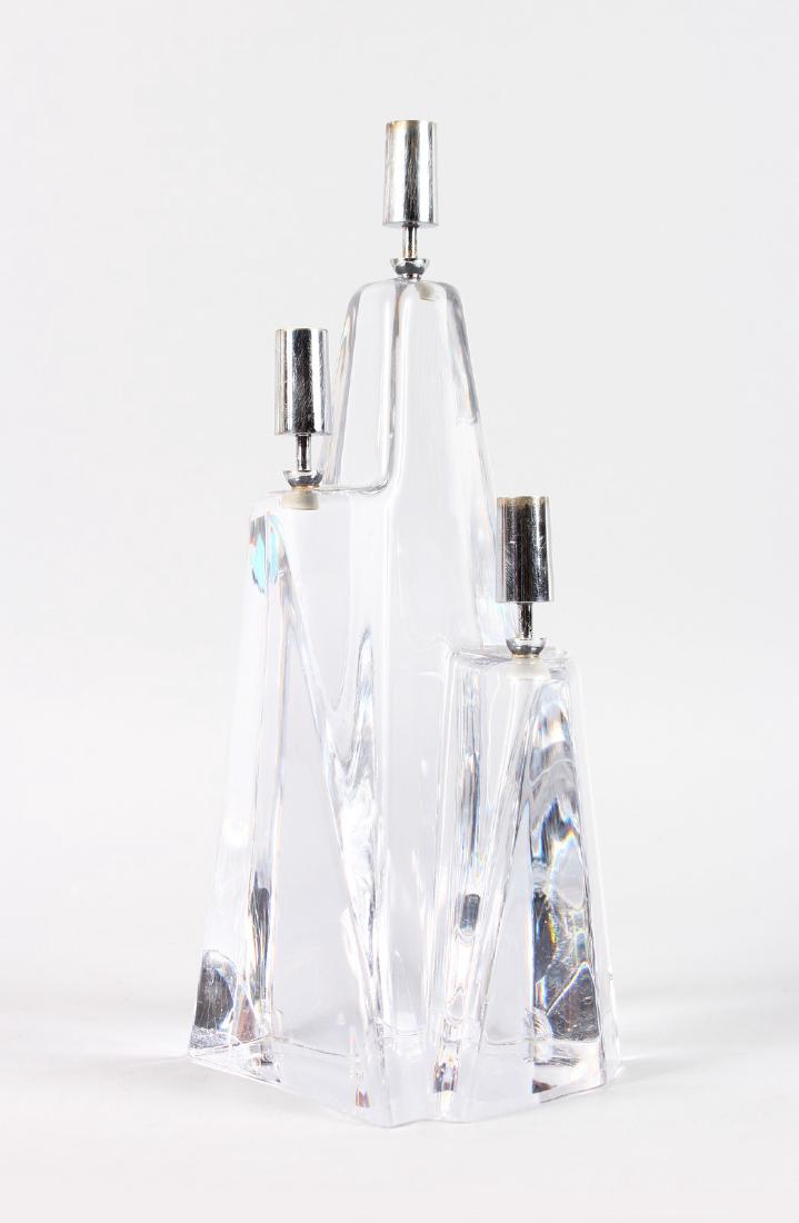 A HEAVY DAUM GLASS THREE LIGHT CANDLESTICK. Engraved: A HEAVY DAUM GLASS THREE LIGHT CANDLESTICK. Engraved Daum, France. 11ins high.