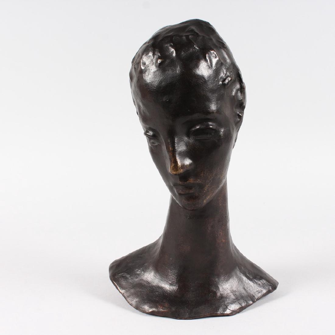 AFTER W. LEHMBRUCK BRONZE HEAD OF A YOUNG WOMAN.: AFTER W. LEHMBRUCK BRONZE HEAD OF A YOUNG WOMAN. Signed W. LEHMBRUCK. Foundry Stamp. 3/6. 38cms high.