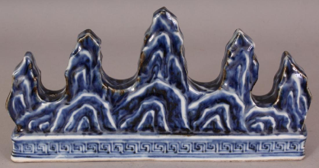 A CHINESE MING STYLE BLUE & WHITE PORCELAIN BRUSH REST, (1 of 6)