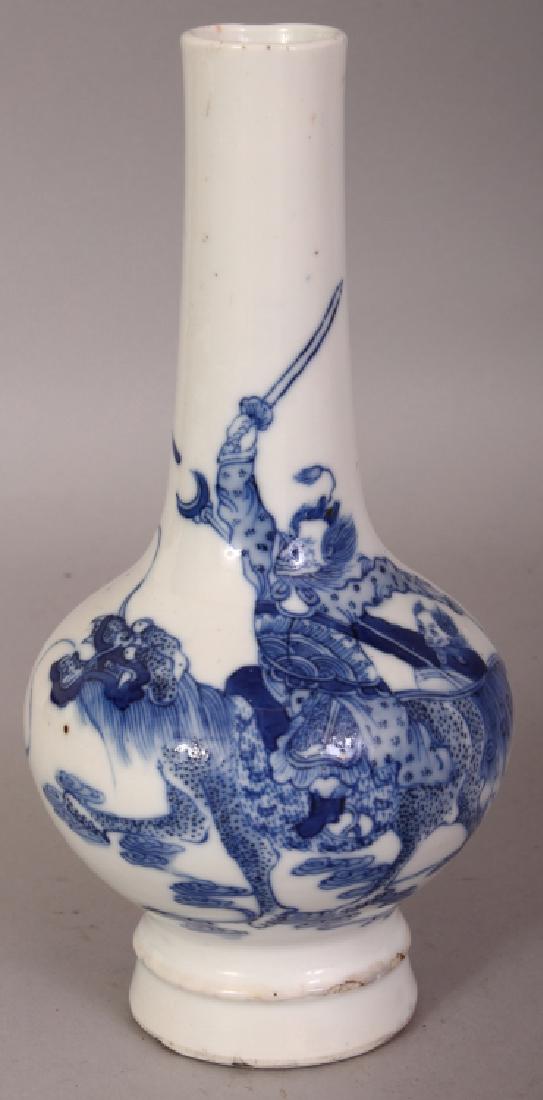 A 19TH CENTURY CHINESE BLUE & WHITE PORCELAIN VASE,: A 19TH CENTURY CHINESE BLUE & WHITE PORCELAIN VASE, supported on a stepped foot, the sides unusually painted with a demon warrior on a buddhistic lion, the base with a six-character Kangxi mark, 8in h