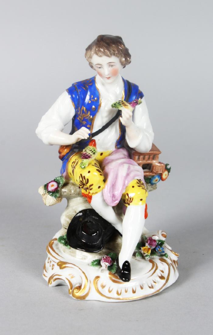 A SITZENDORF PORCELAIN FIGURE OF A YOUNG MAN seated on (1 of 4)