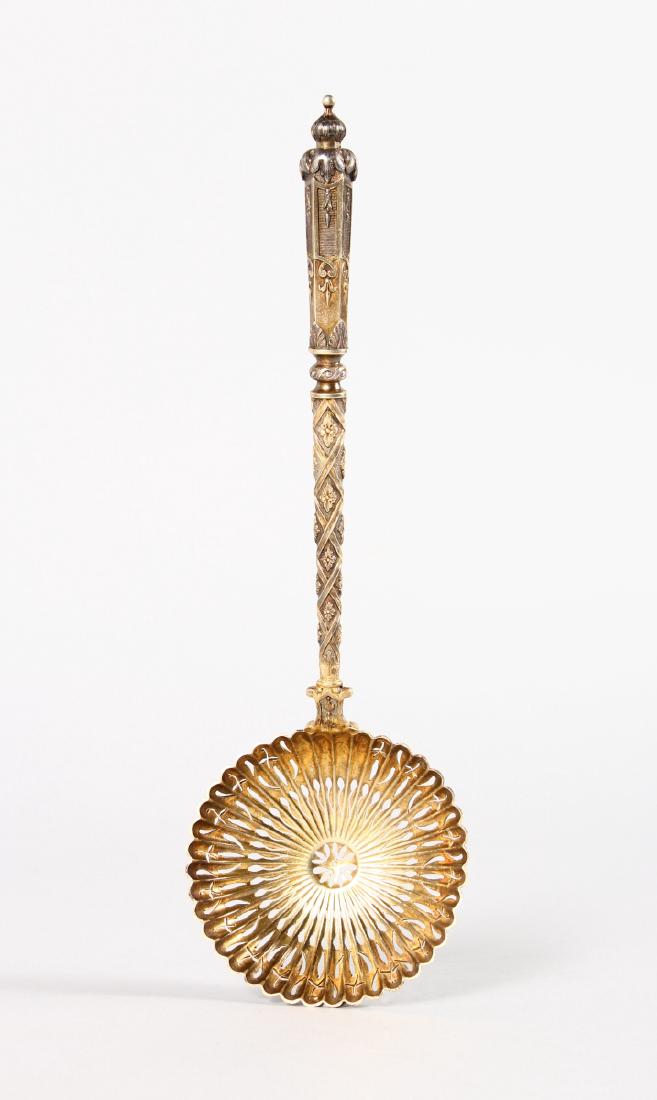 A GOOD PIERCED SILVER GILT LADLE, possibly Russian. (1 of 5)