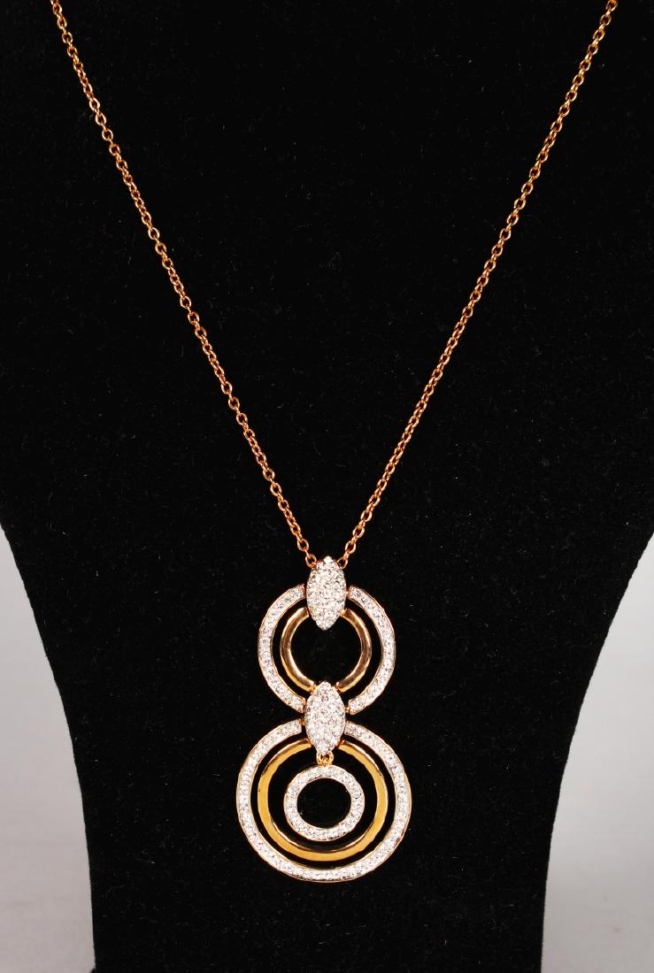 A MARTIN JAMES PASTE PENDANT AND CHAIN in a leather (1 of 2)