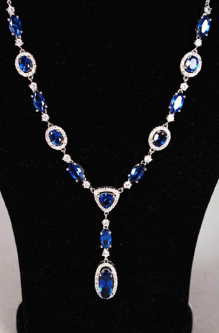 A MARTIN JAMES SILVER AND BLUE STONE NECKLACE in a: A MARTIN JAMES SILVER AND BLUE STONE NECKLACE in a leather box.
