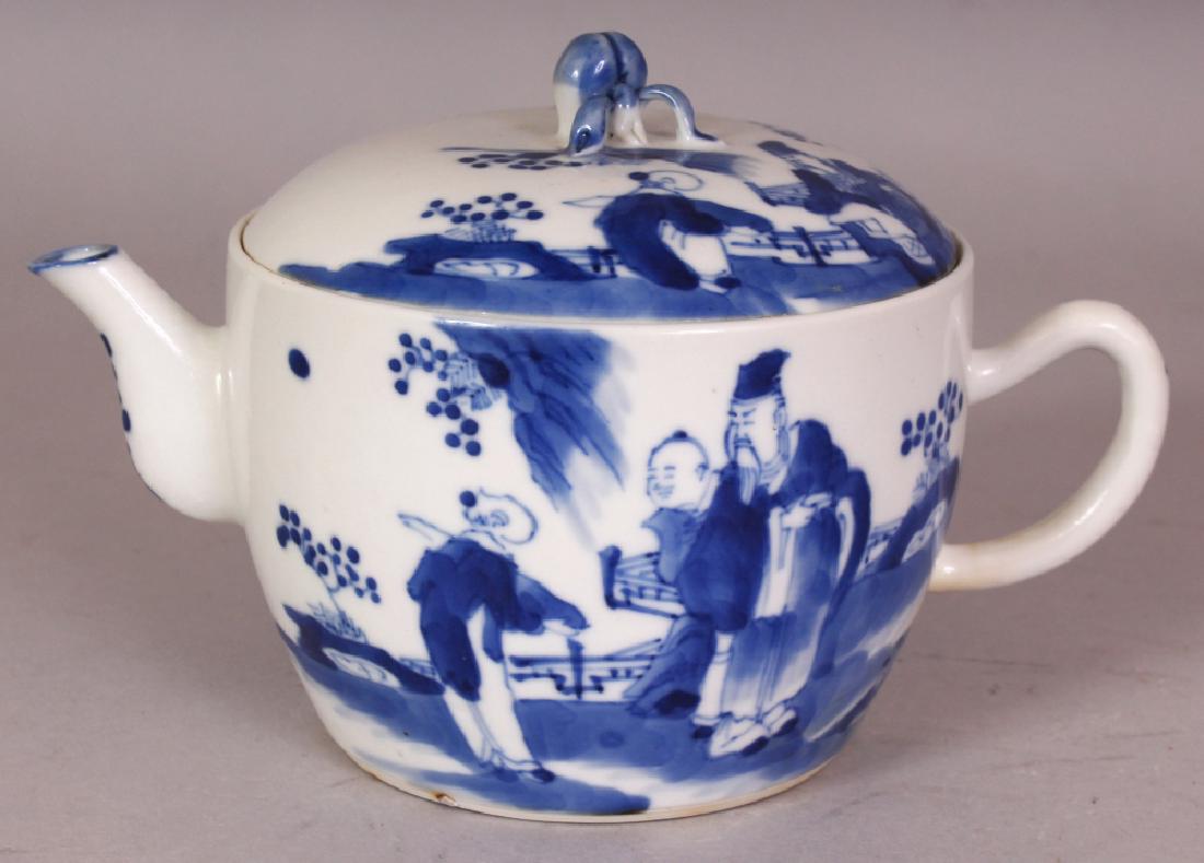 A 19TH CENTURY CHINESE BLUE & WHITE PORCELAIN TEAPOT &: A 19TH CENTURY CHINESE BLUE & WHITE PORCELAIN TEAPOT & COVER, painted with scenes of a sage and boy attendant, the domed cover moulded with a peach finial, 6.5in long including handle and spout & 4.25