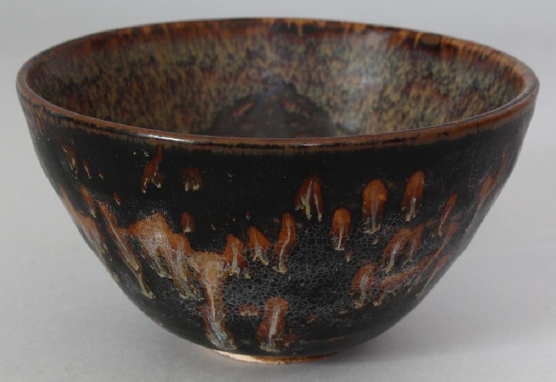 A CHINESE SONG STYLE JIZHOU PAPERCUT CERAMIC BOWL, the (1 of 5)