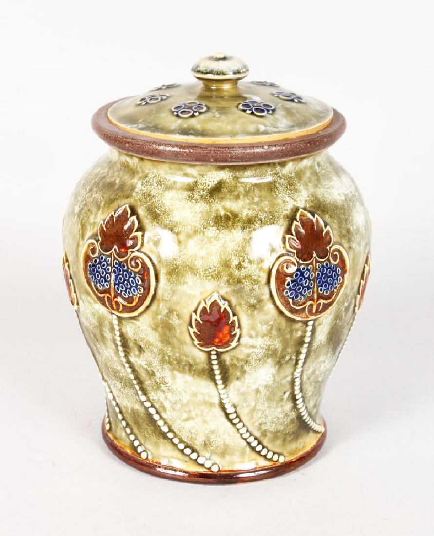 A ROYAL DOULTON STONEWARE TOBACCO JAR AND COVER by MARY