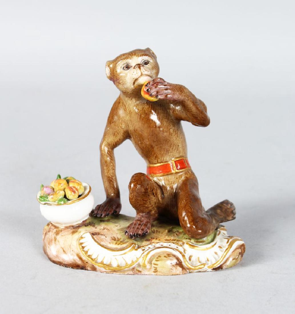 A SMALL EARLY 19TH CENTURY MEISSEN FIGURE OF A MONKEY: A SMALL EARLY 19TH CENTURY MEISSEN FIGURE OF A MONKEY eating fruit from a bowl by his side. Cross swords mark in blue. 3.5ins high.
