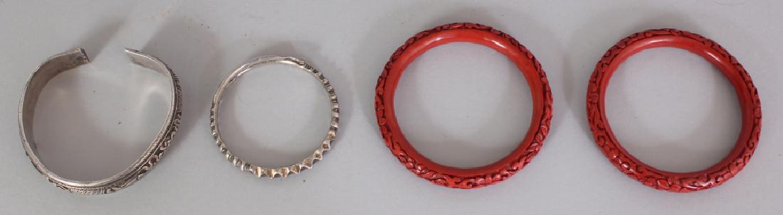 TWO CHINESE RED CINNABAR LACQUER BANGLES, together with (1 of 7)