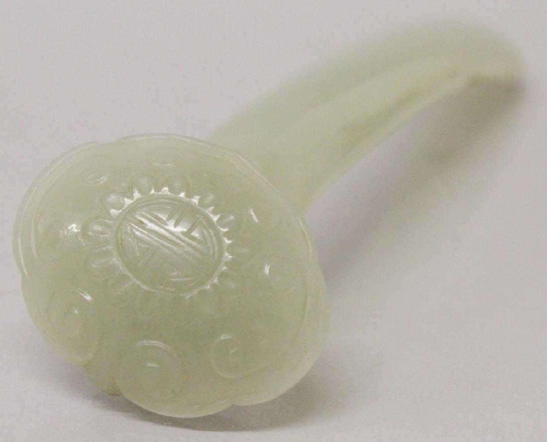 A CHINESE CELADON JADE MODEL OF A RUYI SCEPTRE, its (1 of 4)