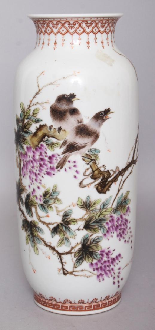 A CHINESE REPUBLIC STYLE FAMILLE ROSE PORCELAIN VASE,: A CHINESE REPUBLIC STYLE FAMILLE ROSE PORCELAIN VASE, decorated with two birds perched on a blossoming branch, the base with a seal mark, 10.3in high.