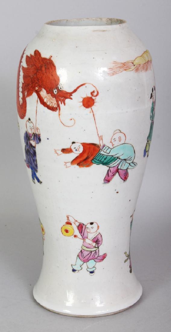 A 19TH/20TH CENTURY CHINESE FAMILLE ROSE PORCELAIN: A 19TH/20TH CENTURY CHINESE FAMILLE ROSE PORCELAIN VASE, painted with boys in a dragon procession, 9in high.